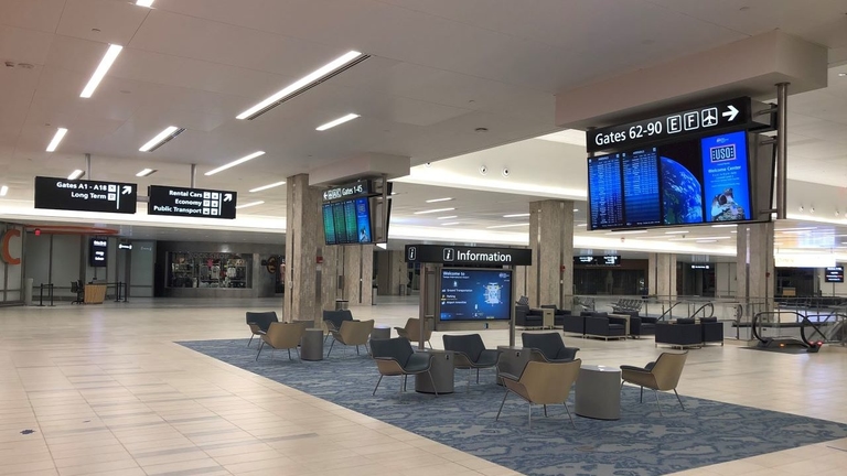 Airport terminal, featuring modern design and spacious waiting areas.